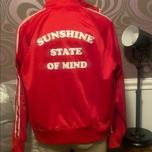 Red athletic jacket worn twice